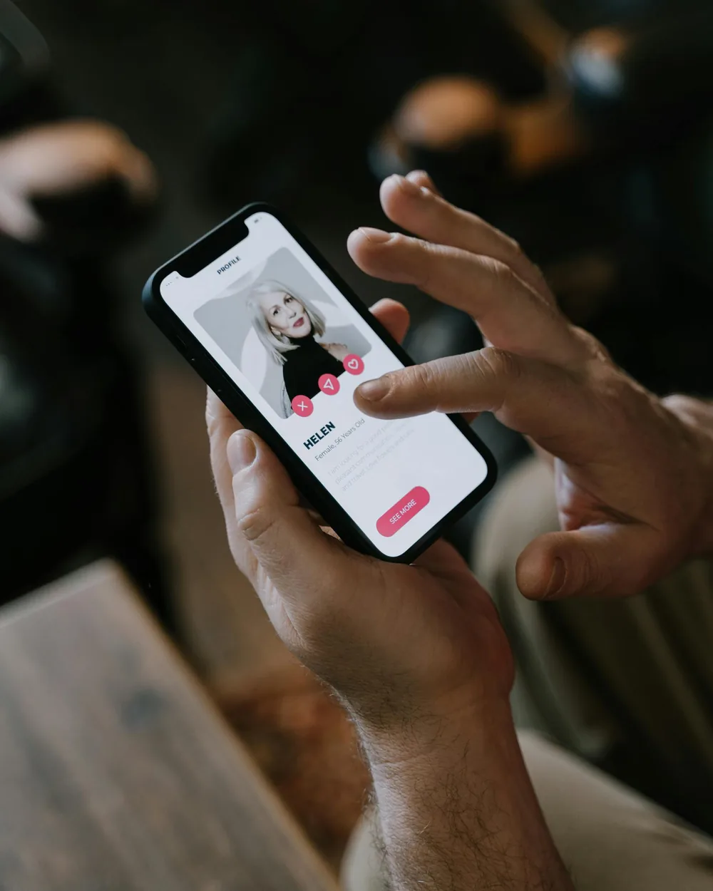 Stock photo of hands using a dating app on a smartphone